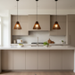 White oak Rhythm pendants over kitchen island